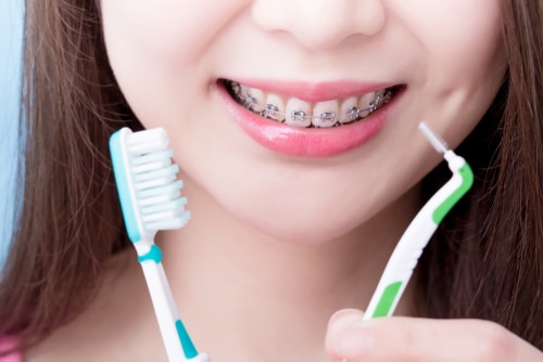 How to Brush with Braces Buffalo Orthodontists Free Consultations
